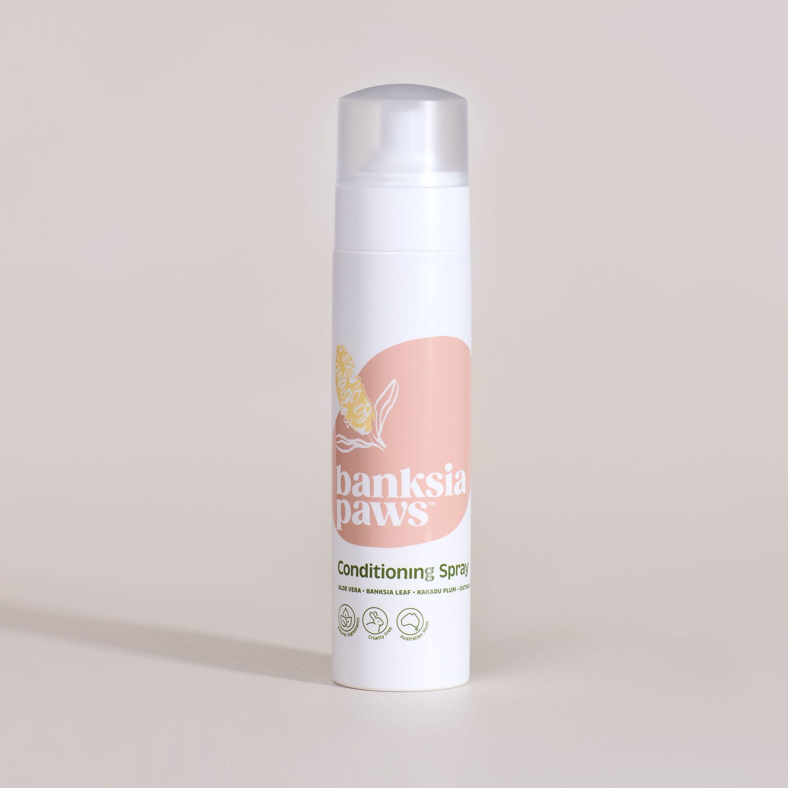 Banksia Paws conditioning spray bottle on a beige background