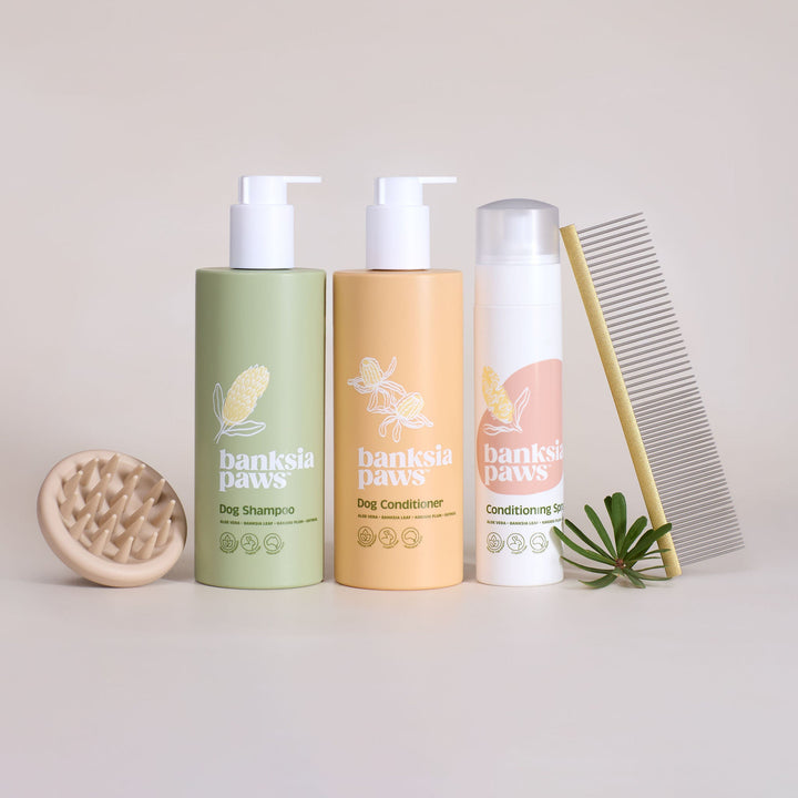 Ultimate Starter Bundle - Three bottles of 'banksie paws' pet care products with a comb on a light background